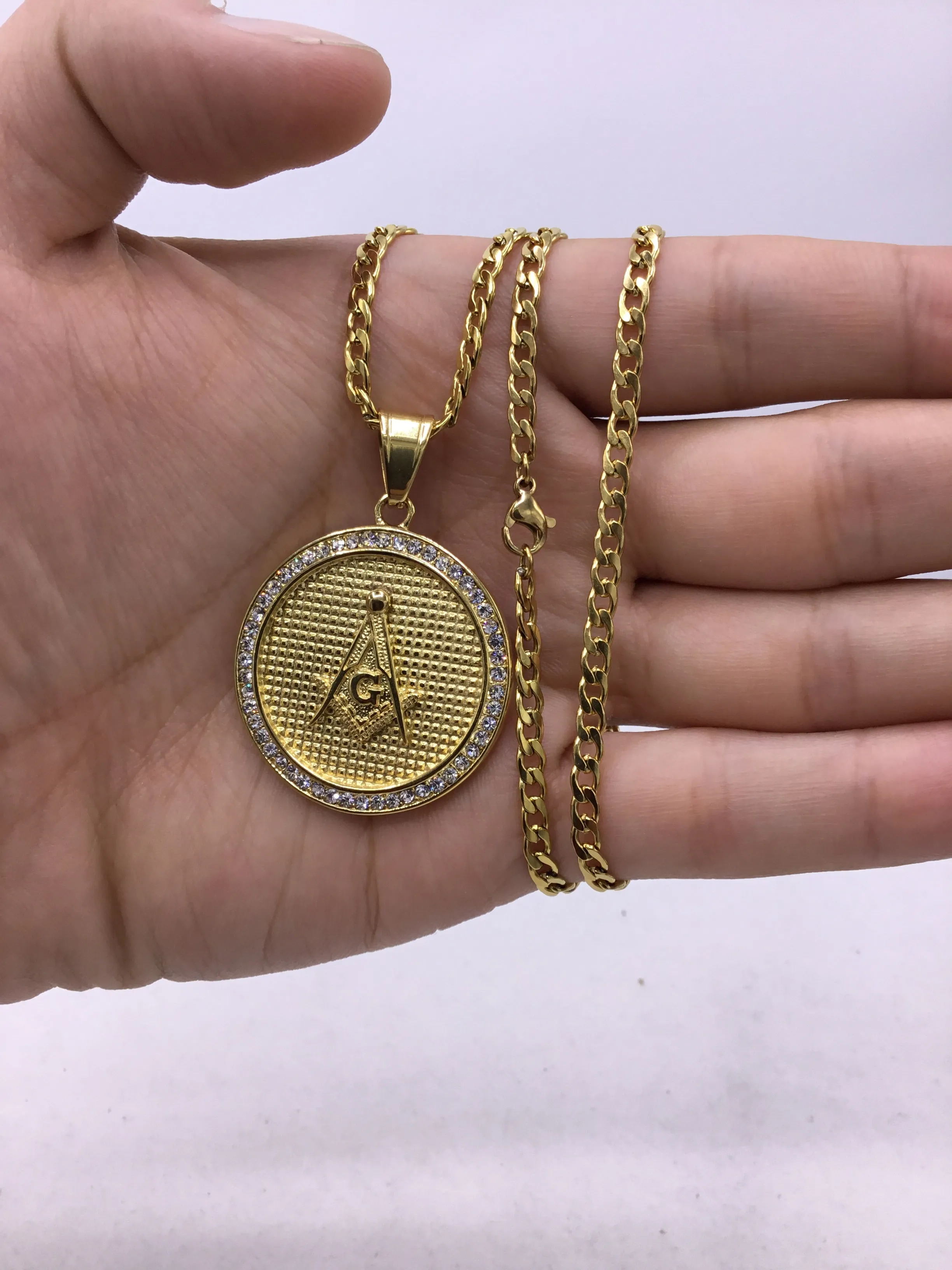 18k gold over stainless steel Medallion with Cubic Zirconia includes Cuban link chain set