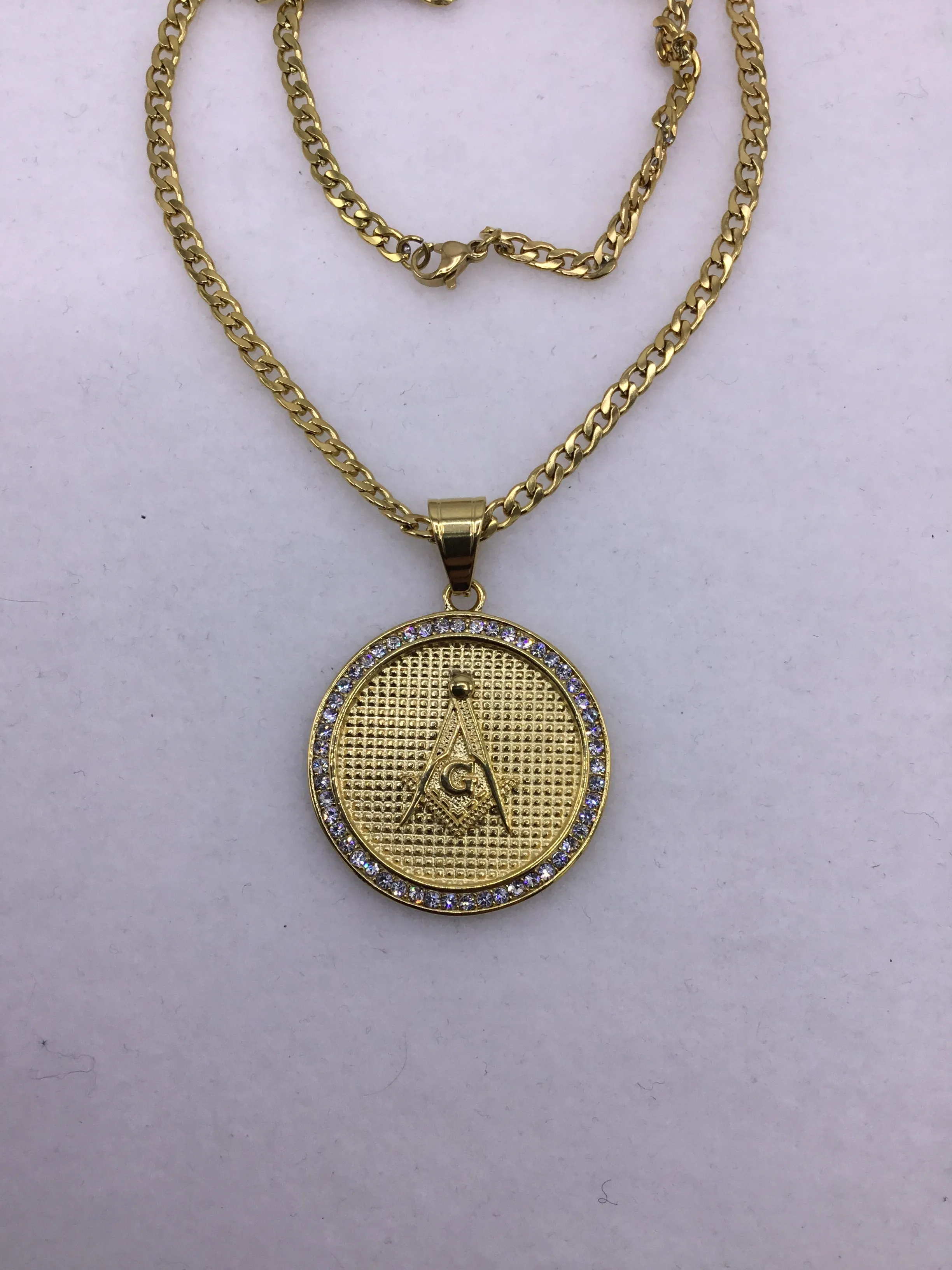 18k gold over stainless steel Medallion with Cubic Zirconia includes Cuban link chain set