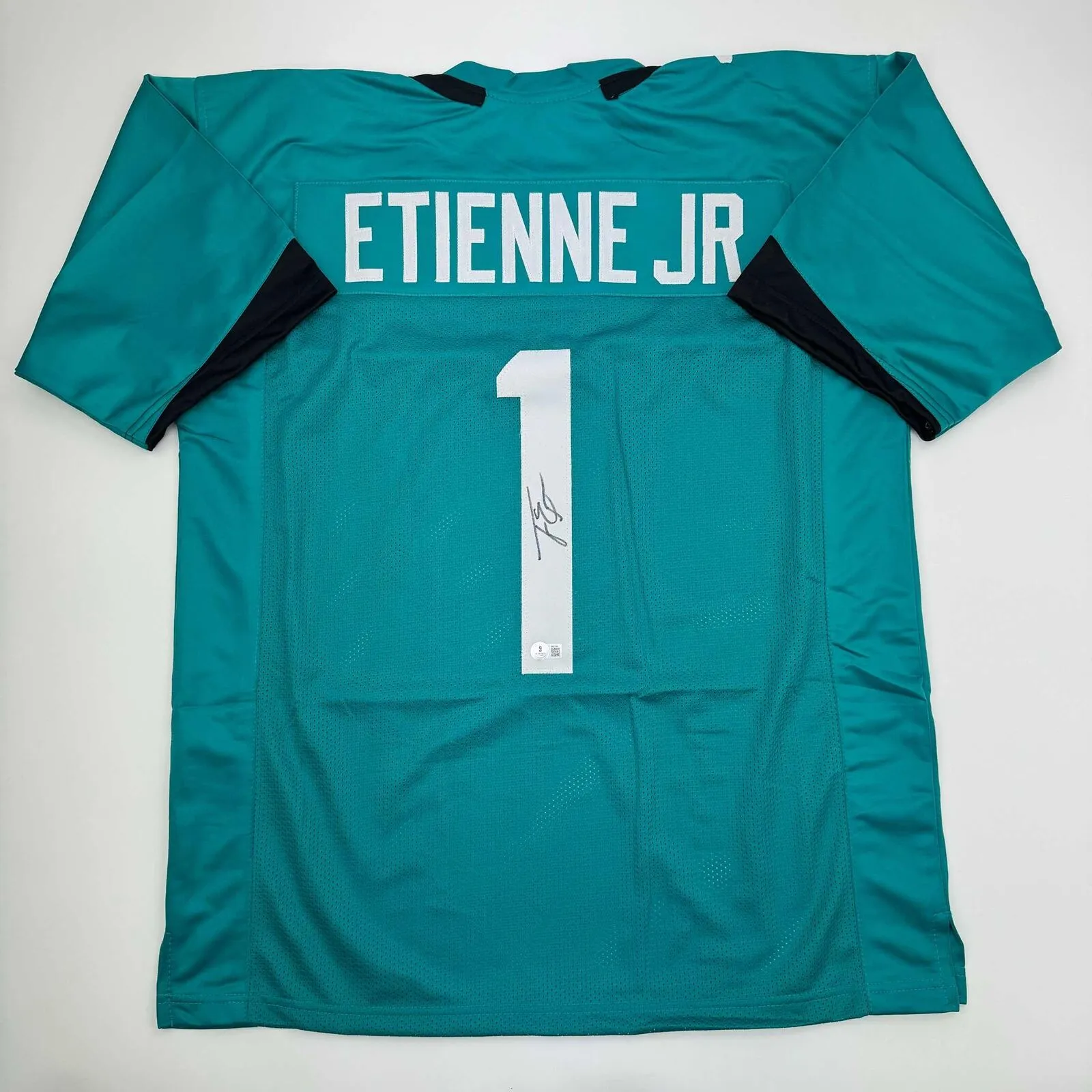 Autographed/Signed Travis Etienne Jr. Jacksonville Teal Jersey Beckett BAS COA